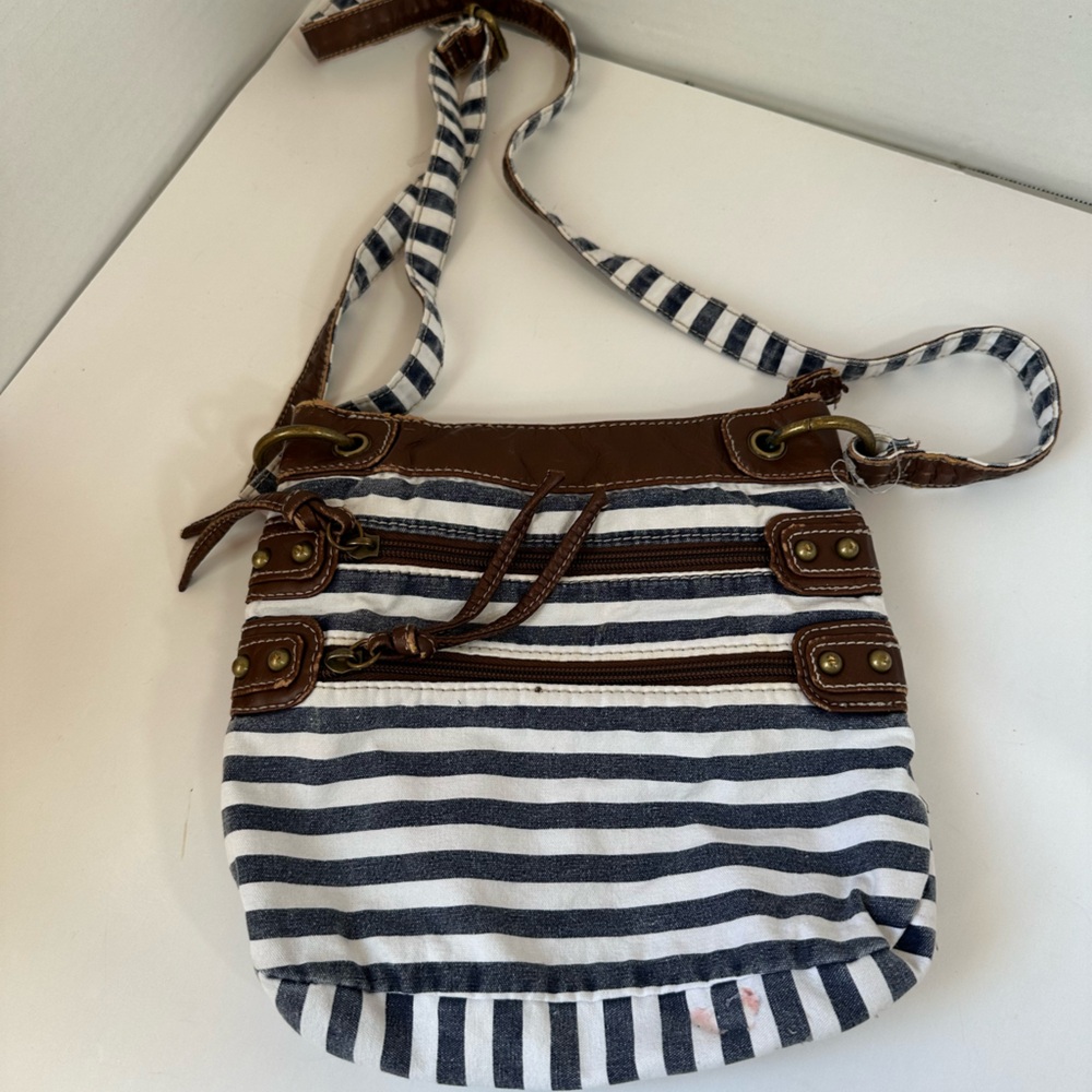 Maurice’s blue and white striped crossbody purse with brown faux leather detail
